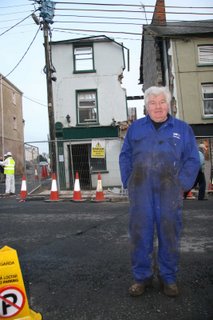 Martin_Treacy_the_proprietor,_as_the_demolition_of_his_old_premises_begins_in_Bruff